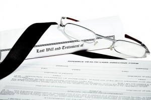 Will and Testament with Glasses Pen and Income Tax Return